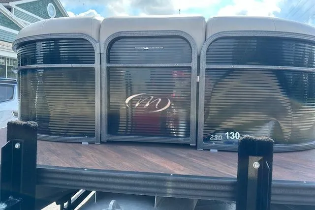 Slide: The Image of 2017 Manitou 23 Oasis pontoon boat with sleek design and modern features. - 5