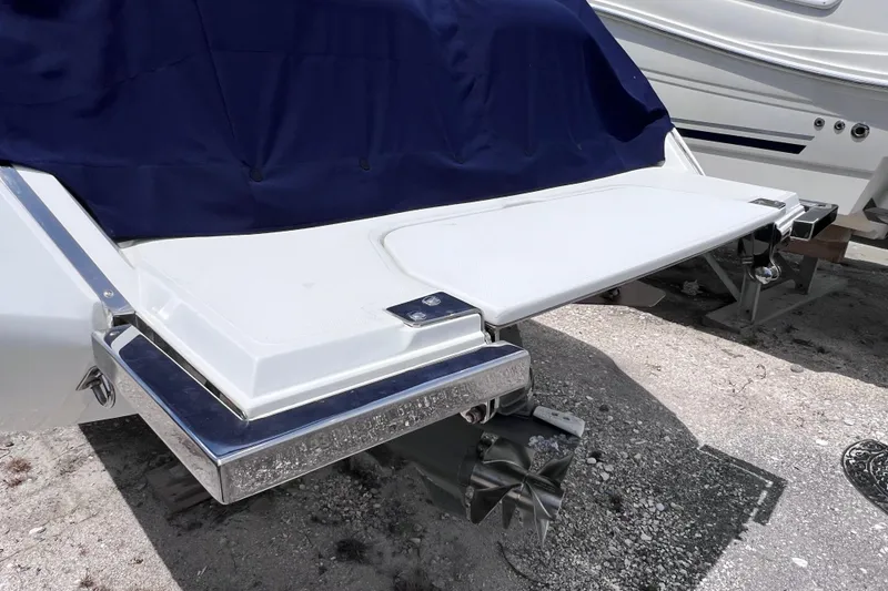 Slide: The Image of 2015 Cobalt 26SD boat with covered stern and swim platform. - 11