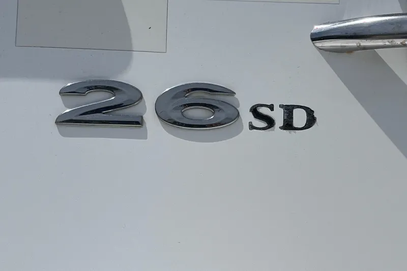 Slide: The Image of Chrome "26 SD" emblem on a 2015 Cobalt boat. - 28