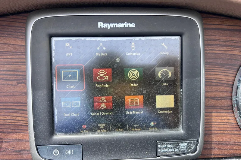 Slide: The Image of Raymarine navigation display on 2015 Cobalt 26SD boat dashboard, showing various marine functions. - 45