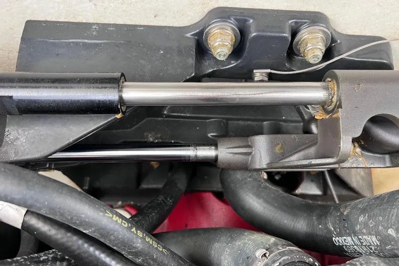 Slide: The Image of Close-up of mechanical components and hoses in a 2015 Cobalt 26SD boat. - 57