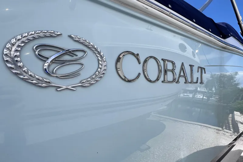 Slide: The Image of 2015 Cobalt 26SD boat with logo and emblem on the side. - 8