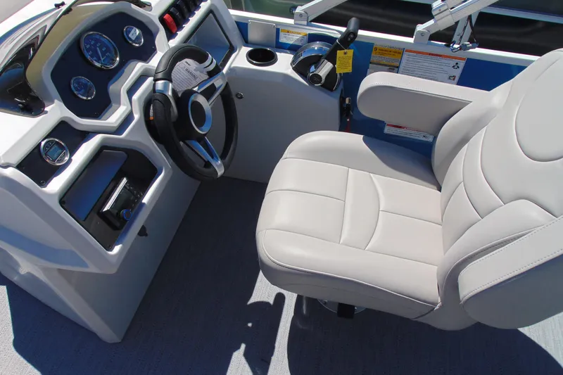 Slide: The Image of Captain's seat and dashboard of 2026 Godfrey eX1680 CX boat, featuring modern controls. - 10