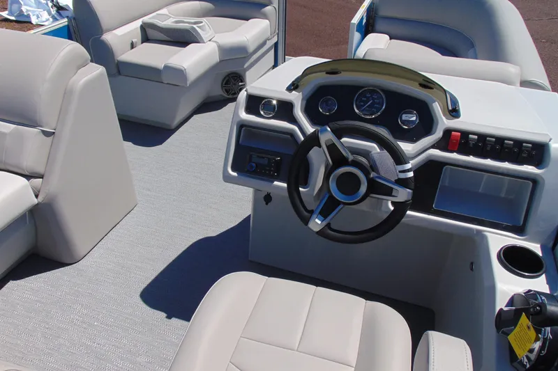 Slide: The Image of 2026 Godfrey eX1680 CX boat interior with modern steering and seating. - 11