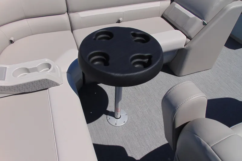 Slide: The Image of Luxurious seating and cup holders on 2026 Godfrey eX1680 CX boat interior. - 12