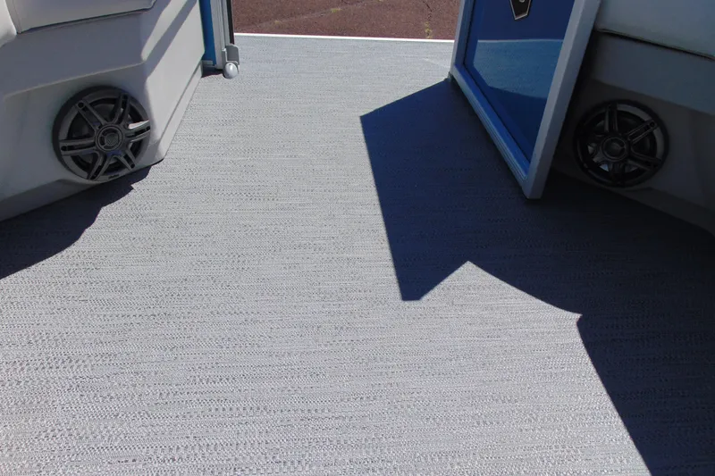 Slide: The Image of Interior view of 2026 Godfrey eX1680 CX boat with speakers and carpeted flooring. - 15