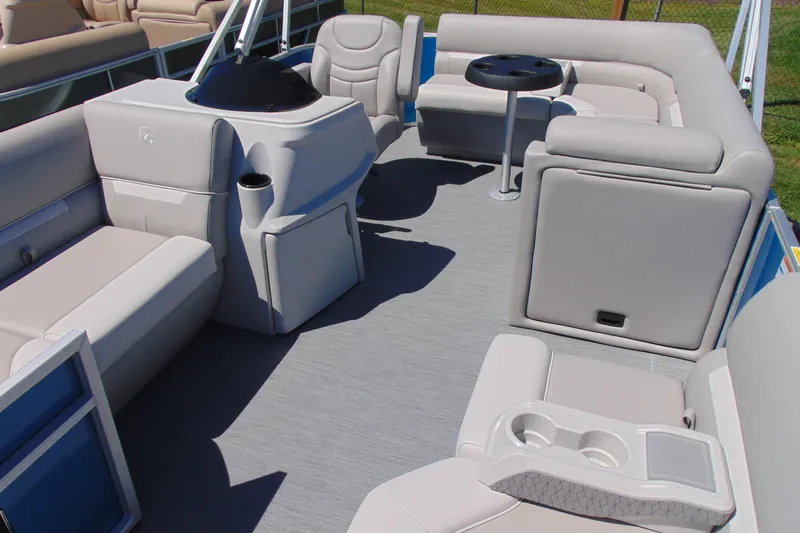 Slide: The Image of 2026 Godfrey eX1680 CX pontoon boat interior with plush seating and modern helm. - 5