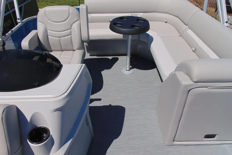 Slide: The Image of Interior of 2026 Godfrey eX1680 CX pontoon boat with plush seating and table. - 6