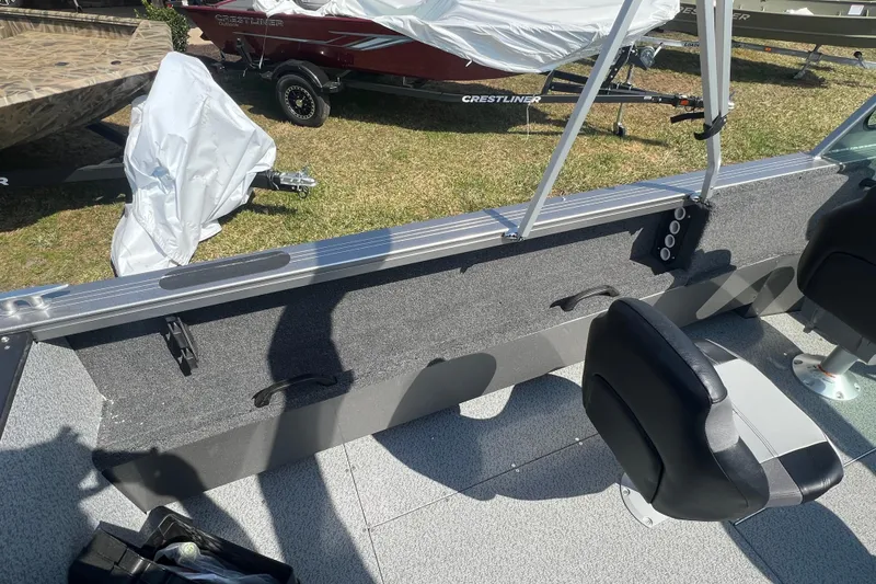 Slide: The Image of 2025 Crestliner 1850 Commander interior with seating and storage, showcasing modern design features. - 15