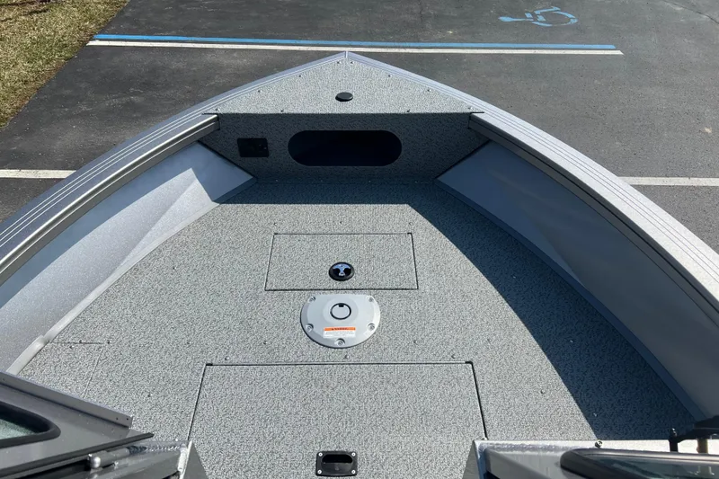 Slide: The Image of 2025 Crestliner 1850 Commander boat deck, featuring spacious and durable design. - 4