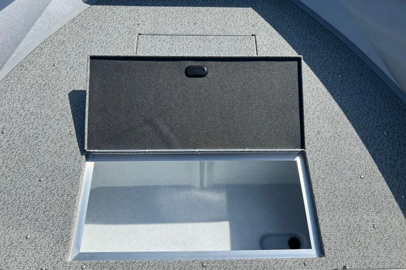Slide: The Image of Open storage compartment on 2025 Crestliner 1850 Commander boat deck. - 6