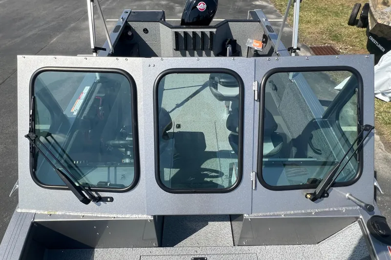 Slide: The Image of 2025 Crestliner 1850 Commander boat with windshield and interior view. - 8