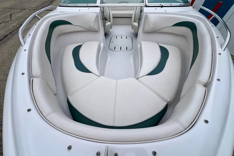 Slide: The Image of 2000 Four Winns 190 Horizon SS boat interior with white and green seating. - 3