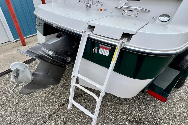 Slide: The Image of 2000 Four Winns 190 Horizon SS boat with ladder and propeller detail. - 5