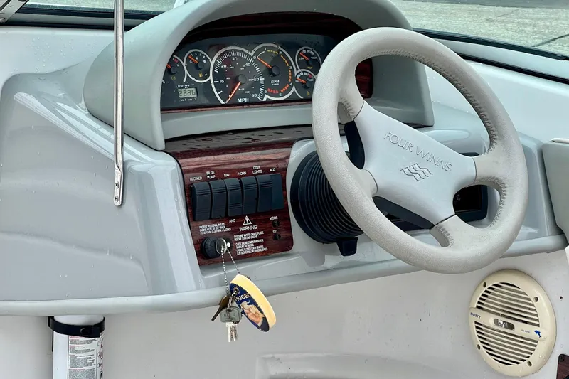 Slide: The Image of Steering wheel and dashboard of 2000 Four Winns 190 Horizon SS boat. - 8