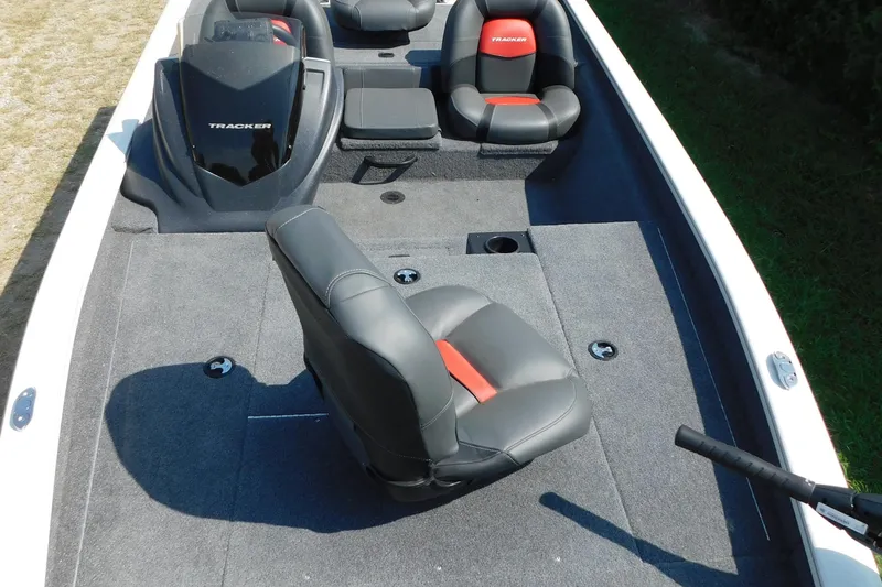 Slide: The Image of 2025 Tracker Pro Team 175 boat interior with gray and red seating, spacious deck. - 4