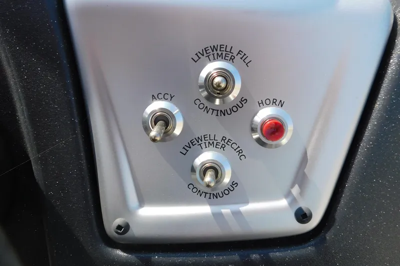 Slide: The Image of Control panel of 2025 Tracker Pro Team 175 boat with switches and horn button. - 6