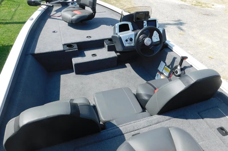 Slide: The Image of 2025 Tracker Pro Team 175 boat interior with steering wheel and seating. - 7