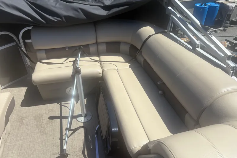 Slide: The Image of 2021 Sun Tracker Party Barge 20 DLX with beige seating and spacious interior. - 6