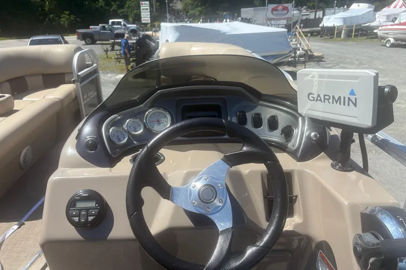Slide: The Image of 2021 Sun Tracker Party Barge 20 DLX dashboard with Garmin navigation system. - 7