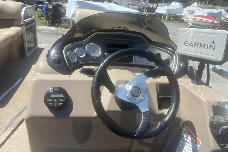 Slide: The Image of 2021 Sun Tracker Party Barge 20 DLX dashboard with Garmin navigation system. - 9