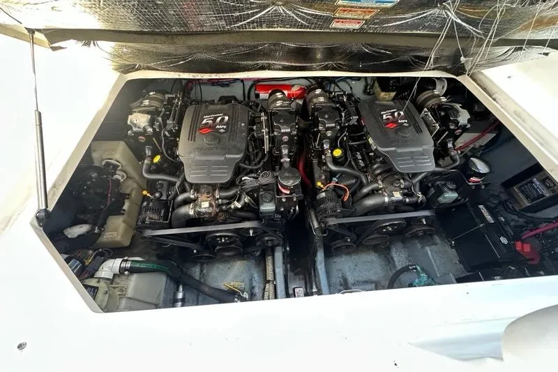 Slide: The Image of Engine compartment of 2004 Sea Ray 280 Sundancer with twin 5.0 MPI engines. - 27