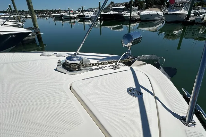 Slide: The Image of Bow of 2004 Sea Ray 280 Sundancer with anchor chain, docked in marina. - 31