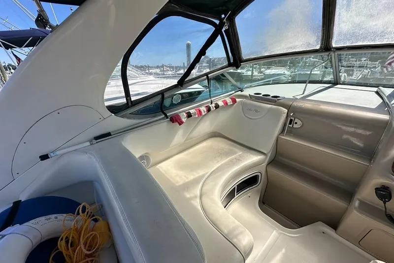 Slide: The Image of Interior view of 2004 Sea Ray 280 Sundancer boat with seating and dashboard. - 4
