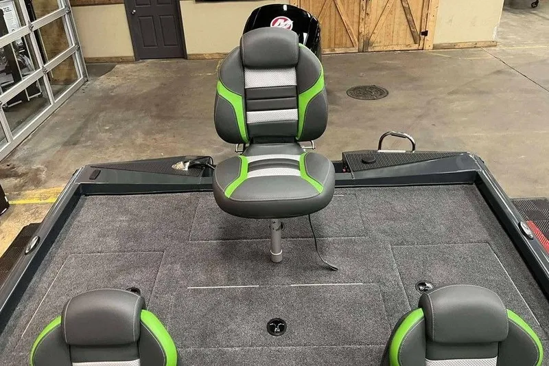 Slide: The Image of 2026 Ranger RT188P boat interior with gray and green seating on a carpeted deck. - 5