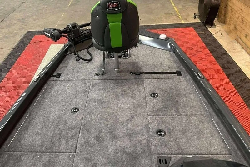 Slide: The Image of 2026 Ranger RT188P boat interior with gray carpet and green-accented seat. - 6