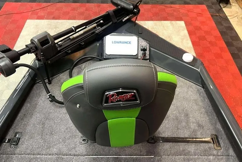 Slide: The Image of 2026 Ranger RT188P boat interior with Lowrance electronics and green-accented seat. - 8