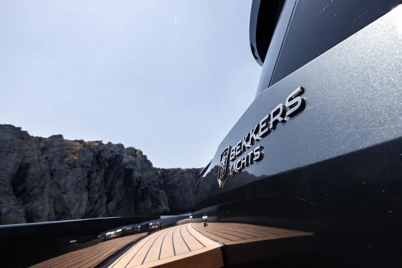 Slide: The Image of Bekkers Yachts Azur 45HT 2023, sleek design with scenic rocky backdrop. - 37