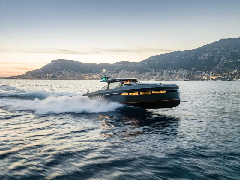 Slide: The Image of 2023 Bekkers Yachts Azur 45HT cruising at sunset near coastal city. - 33