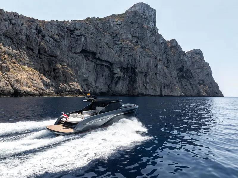 Slide: The Image of 2023 Bekkers Yachts Azur 45HT cruising near rocky cliffs on a sunny day. - 49