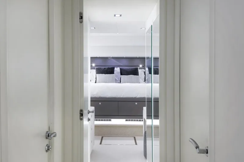 Slide: The Image of Luxurious bedroom interior of 2008 Sunseeker Predator 108 yacht, featuring modern design and elegant decor. - 23