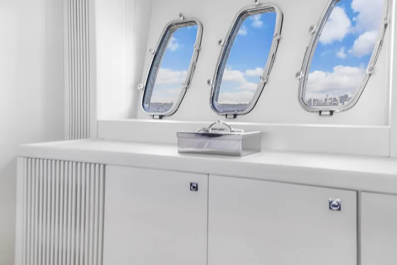 Slide: The Image of Interior of 2008 Sunseeker Predator 108 yacht with porthole windows and sleek white cabinetry. - 30