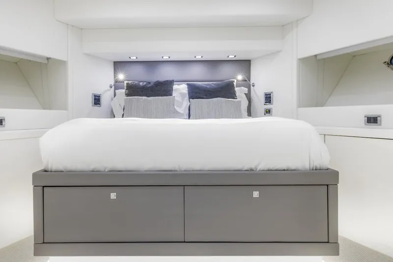 Slide: The Image of Luxurious bedroom interior of 2008 Sunseeker Predator 108 yacht, featuring modern design and elegant bedding. - 37