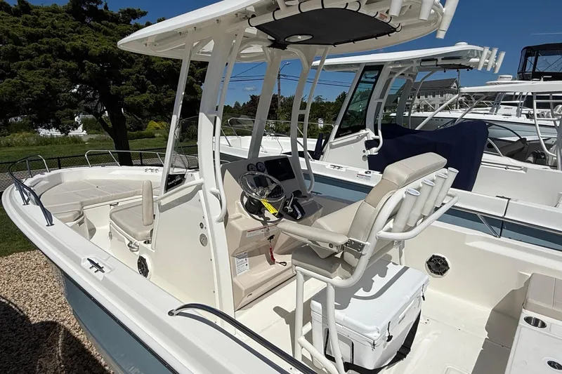 Slide: The Image of 2026 Boston Whaler 250 Dauntless boat interior with helm and seating area. - 10