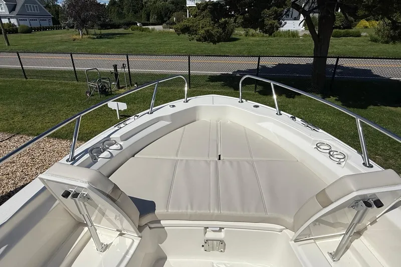 Slide: The Image of 2026 Boston Whaler 250 Dauntless boat with spacious bow seating and stainless steel railings. - 24