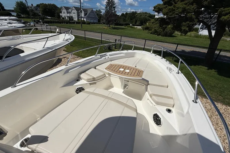 Slide: The Image of 2026 Boston Whaler 250 Dauntless boat with spacious seating and elegant design. - 25