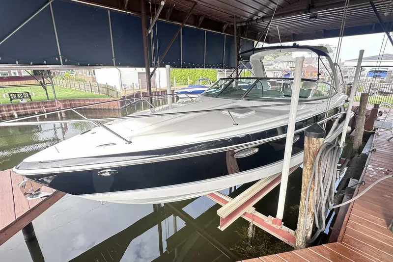 Slide: The Image of 2007 Formula 310 Sun Sport boat docked in a covered marina. - 0