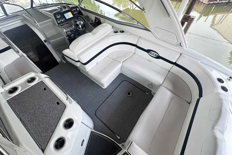 Slide: The Image of 2007 Formula 310 Sun Sport boat interior with white seating and modern dashboard. - 10