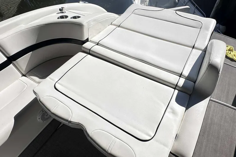 Slide: The Image of 2007 Formula 310 Sun Sport boat interior with white cushioned seating. - 11