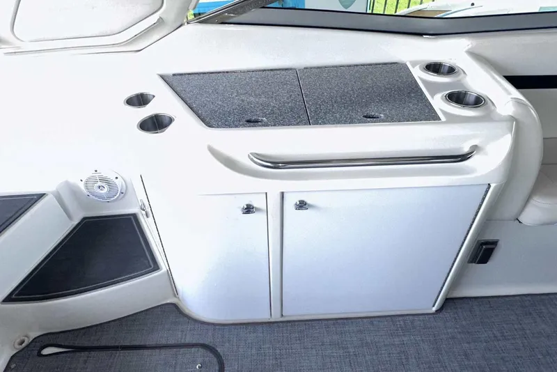 Slide: The Image of 2007 Formula 310 Sun Sport boat interior with storage cabinets and cup holders. - 16
