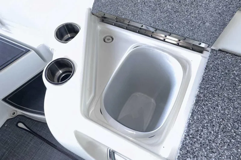 Slide: The Image of 2007 Formula 310 Sun Sport boat interior with cup holders and storage compartment. - 17