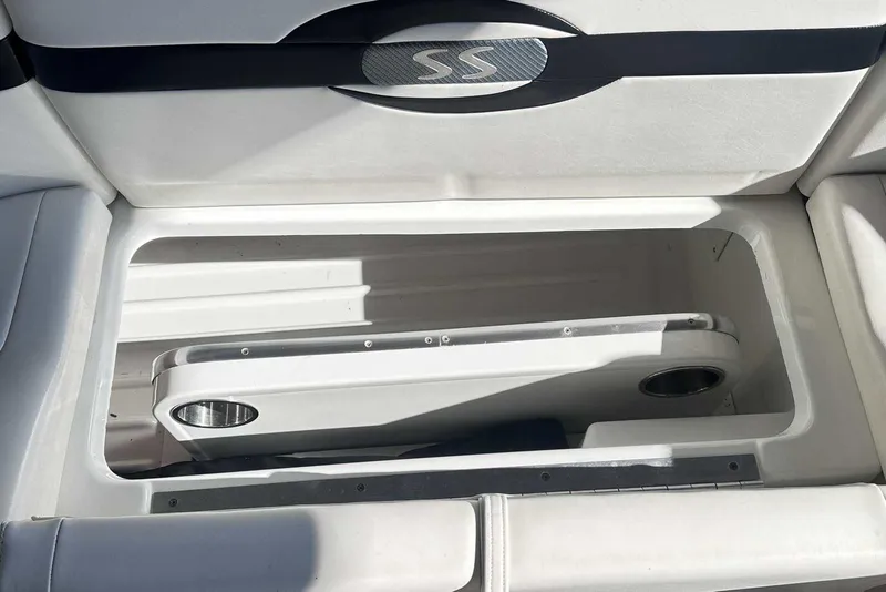 Slide: The Image of 2007 Formula 310 Sun Sport boat storage compartment with cup holders. - 21
