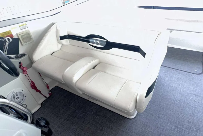 Slide: The Image of 2007 Formula 310 Sun Sport interior with white seating and steering area. - 25