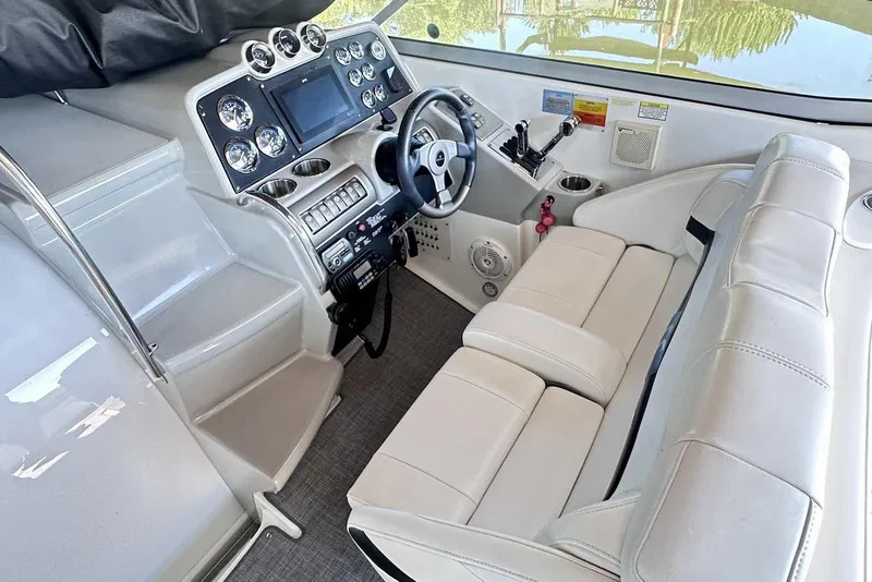 Slide: The Image of 2007 Formula 310 Sun Sport boat interior with modern dashboard and white seating. - 28
