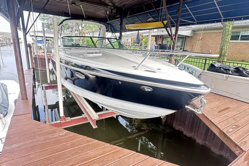 Slide: The Image of 2007 Formula 310 Sun Sport boat docked under a covered marina. - 3