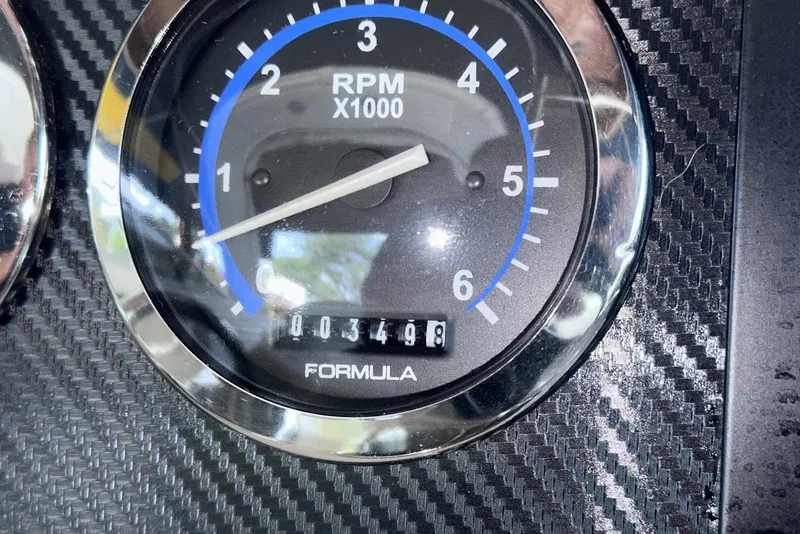Slide: The Image of Close-up of 2007 Formula 310 Sun Sport RPM gauge, showing 3,498 hours. - 34